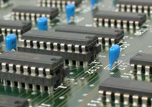 Closeup of a computer motherboard showing electronic parts